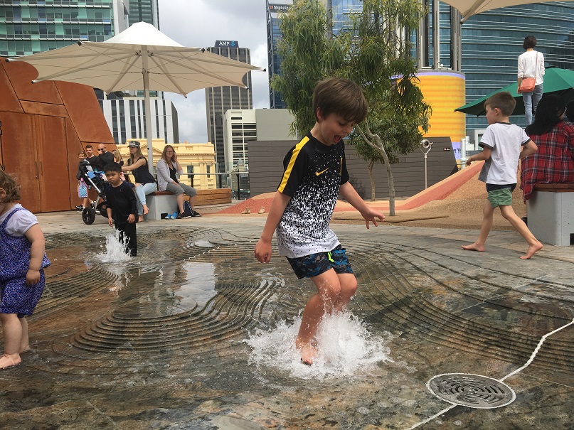 Elevated roof top play space complete with water play for the perfect inner city play for little ones