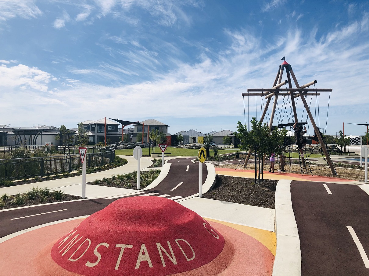 Suburban skate and scooter park with sports court and adventure play