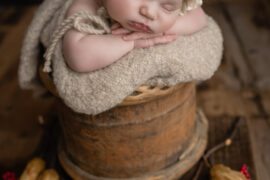 baby wearing hat while sleeping