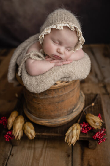 baby wearing hat while sleeping